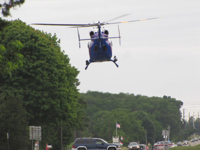 A Suffolk County police helicopter transports a victim from Saturday’s crash. (Credit: Tim Gannon)
