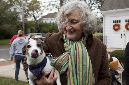 Gail Horton and her dog Sparky wait their turn for a blessing in 2012. (Credit: Katharine Schroeder, file)