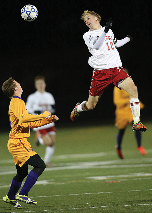 Southold's Shayne Johnson skies high after the ball. (Credit: Garret Meade)