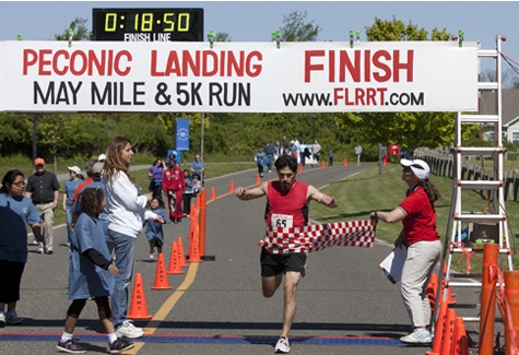 KATHARINE SCHROEDER PHOTO | Jack May of Main winning the May Mile 5K Saturday morning with a time of 18:50.