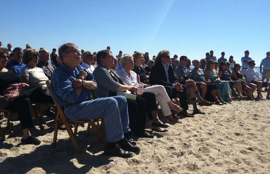Attendees on the beach during Saturday's memorial for Howard Meinke at Mattituck Yacht Club. (Credit: Michael White)