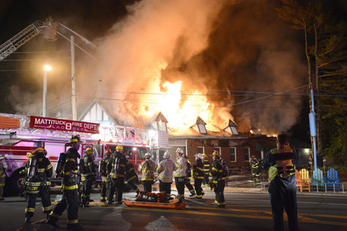 A massive fire destroyed several storefronts on Main Road in Mattituck Friday night and left one man dead. (Credit: Stringer News/A.J. Ryan)