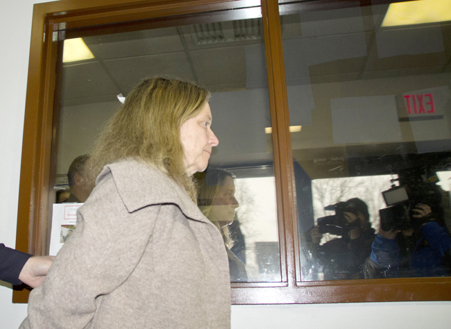 Diane O'Neill of Farmingville is led into Riverhead Town Court last month following a fatal accident in Jamesport. (Credit: Paul Squire, file)