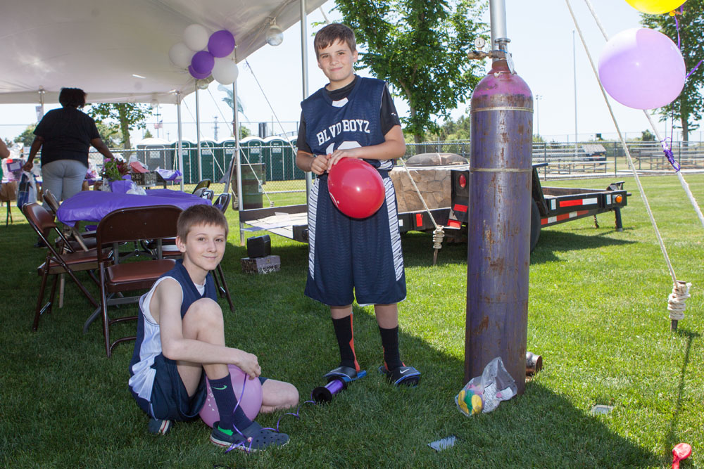 Shane Costello, 12, of East Marion and Thomas Cardi, 11, of Southold volunteered their time to blow up balloons. (Credit: Katharine Schroeder)