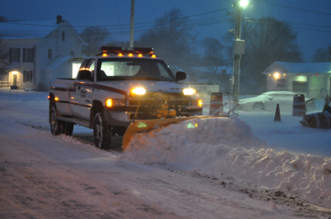 TIM KELLY FILE PHOTO | A snow plow clears Route 25 in Cutchogue in January 2011.