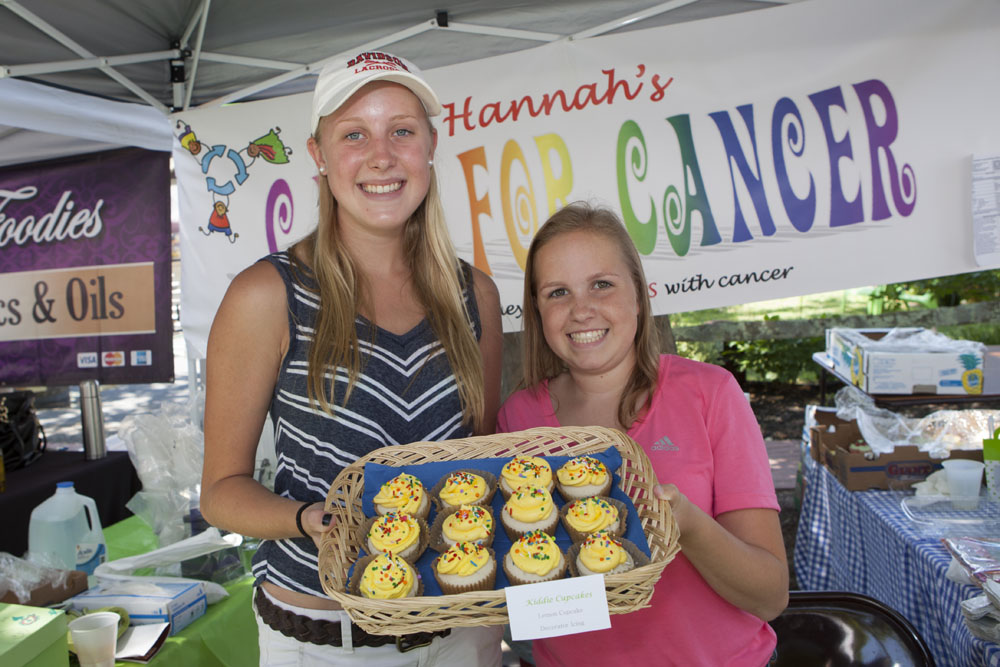 Hannah Prokop, 15, of Mattituck (on right) with her sister Colby, 17.  Hannah, a cancer survivor, raises money to help improve the lives of kids dealing with cancer. (Credit: Katharine Schroeder)
