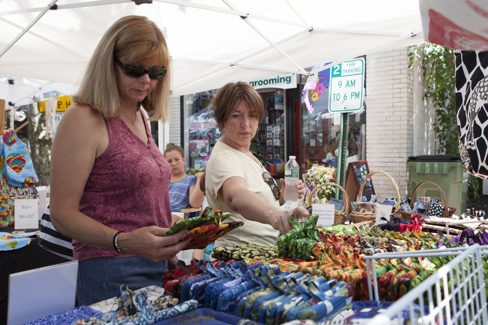 Debbie DeLuca, left, and Linda DiRienzo, both of Branford, Conn., shopping for trinkets. (Credit: Katharine Schroeder)