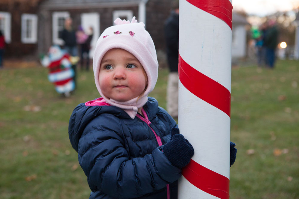 Nineteen-month-old Maeve Flatley of Mattituck holds on tightly to the "North Pole."