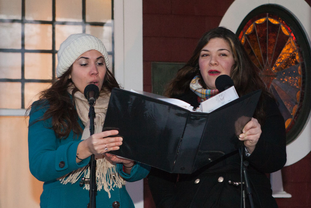 Dana Kowalsick, left, and Kathryn Zukowski sing Christmas carols.