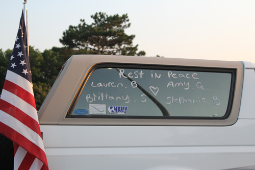 A truck parked outside Wednesday's vigil featuring the names of the four victims. (Credit: Jen Nuzxo)